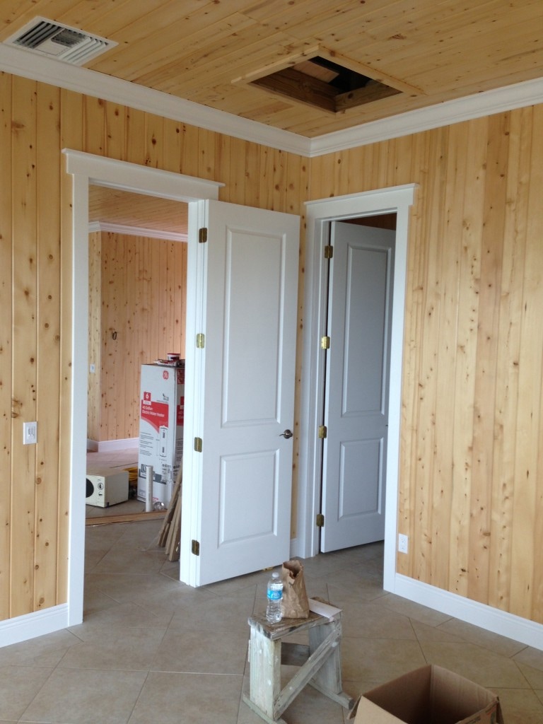 All the tile floors are finished, the doors are hung and the baseboards and crown - installed and painted.