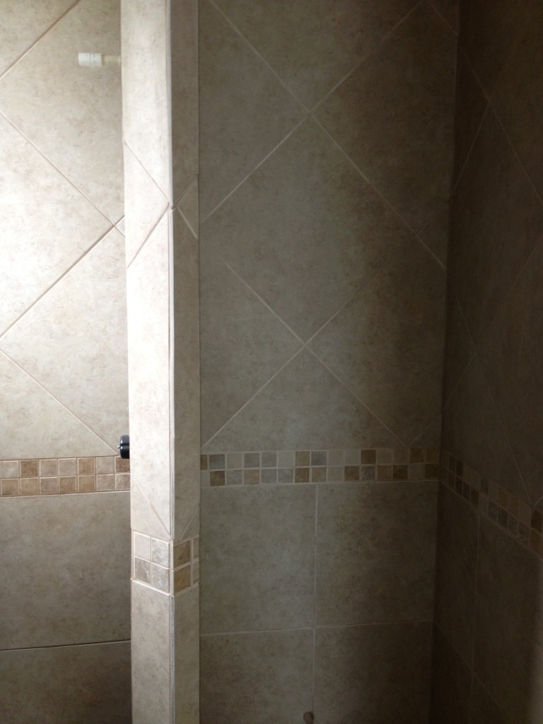 Tile walls in one of the 3 and 1/2 bathrooms. 