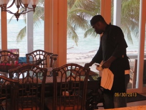 Chef Demeko setting the table for the Romantic Dinner for Two at Camp David.