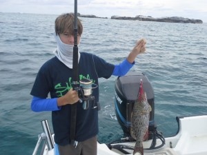 Josh with a yellowfin on a spinning rod.